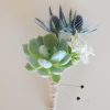 Succulent boutonnieres with thistle