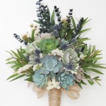 Succulent bouquet with blue thistle and baby eucalyptus