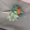 boutonniere with orange bloom