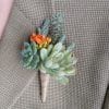 boutonniere with orange bloom