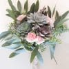 Small succulent bouquet with eucalyptus and pink carnations.