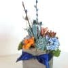 Orange and navy blue succulent arrangement