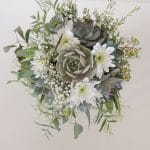 Succulent bridal bouquet with eucalyptus for spray effect.