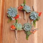 succulent boutonniere with orange kalonchoe bloom