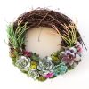 succulent wreath with sticks on fire