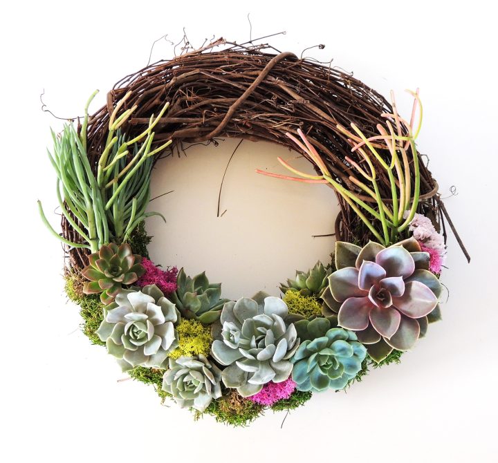 succulent wreath with sticks on fire