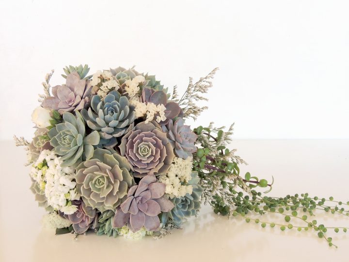 succulent wedding bouquet with pastel colors.
