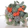 Succulent bouquet with orange spray roses, babies breath and silver dollar eucalyptus.