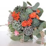 Succulent bouquet with orange spray roses, babies breath and silver dollar eucalyptus.