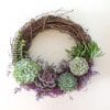 succulent wreath with purple Spanish moss.